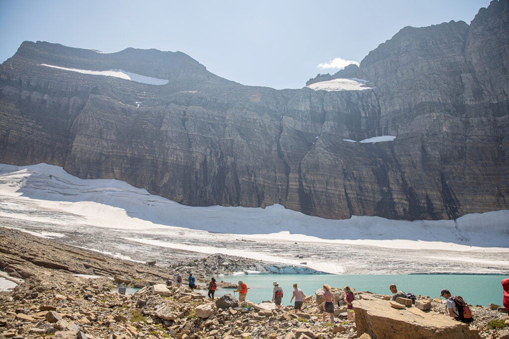 People hike toward Grinnell Glacier in Glacier National Park in Montana. (Glacier National Park)

